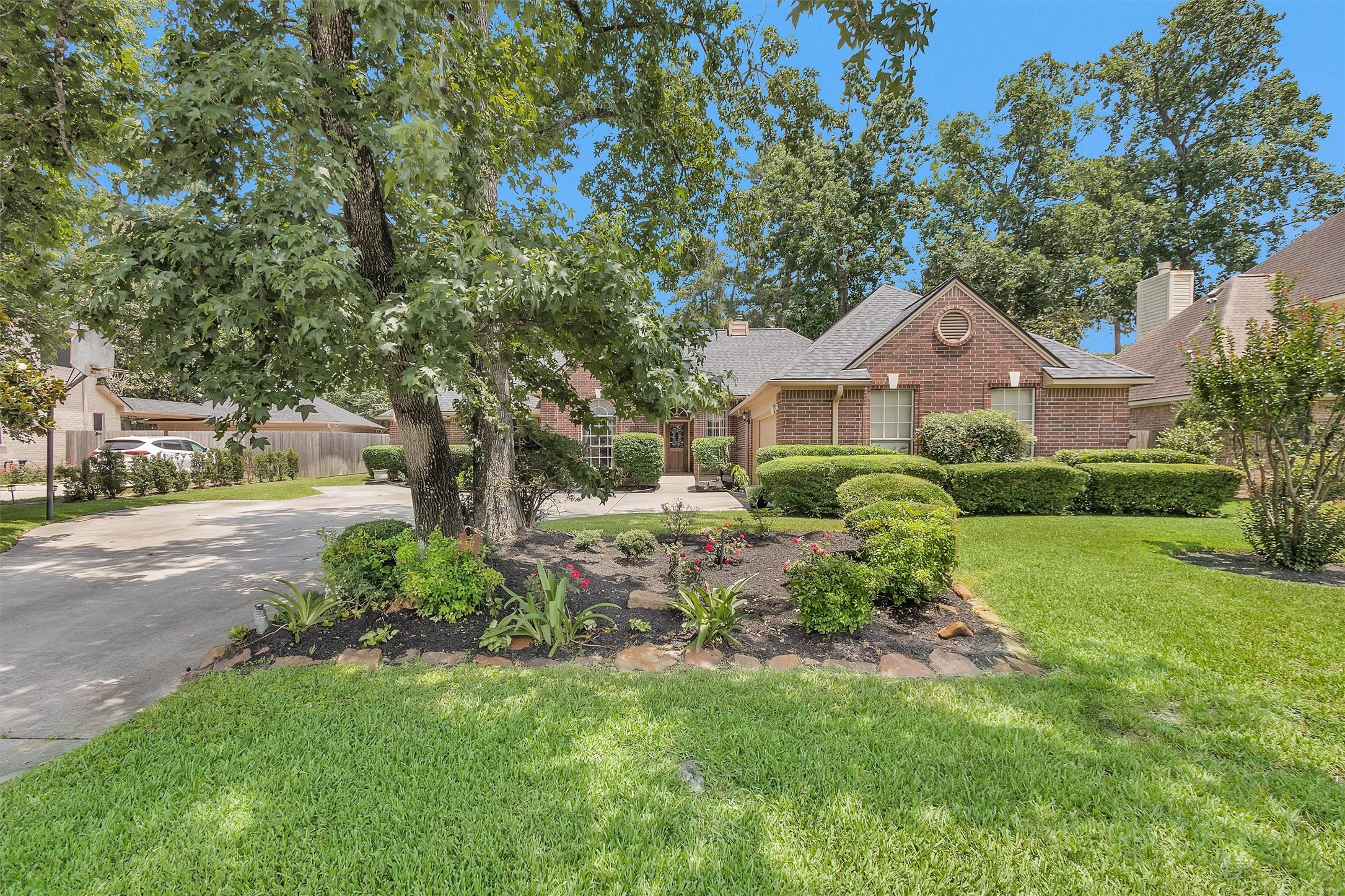 529 Stephen F Austin Drive Conroe, TX 77302 - Photo 9 of 37 a front view of a house with a yard and trees