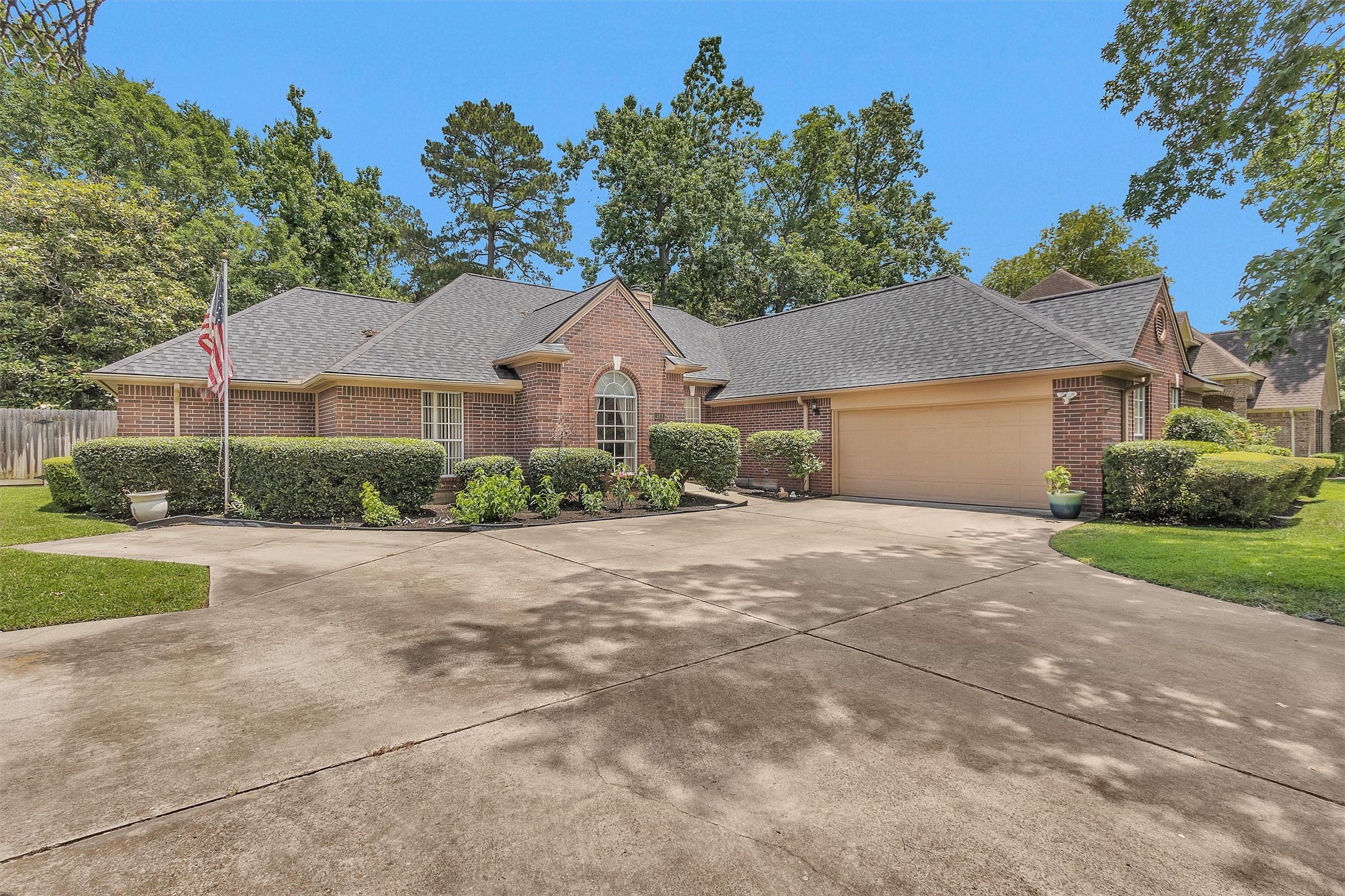 529 Stephen F Austin Drive Conroe, TX 77302 - Photo 10 of 37 a front view of a house with a yard and garage