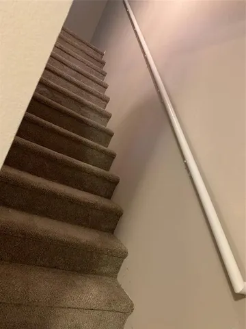 a kitchen with a sink cabinets and appliances