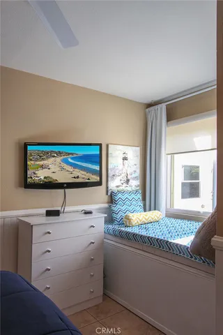 a living room with furniture and a book shelf