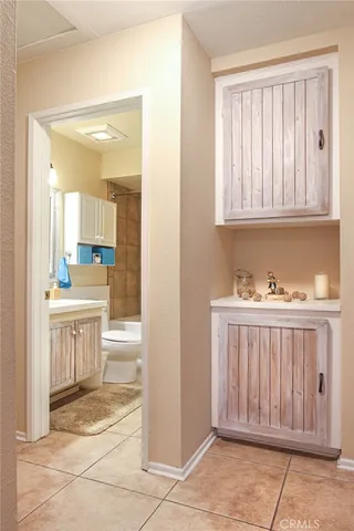 a view of a patio with couches chairs and a umbrella