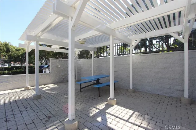 a view of a swimming pool with an outdoor space and seating area