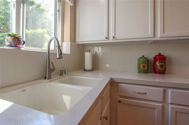 a stove top oven sitting inside of a kitchen
