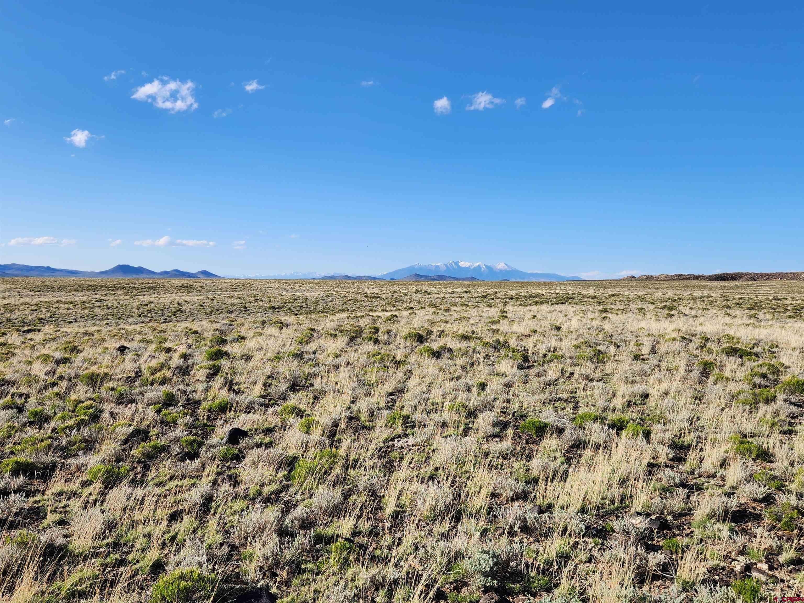0 County Rd H San Luis, CO 81152 - Photo 10 of 11 a view of a sky from a yard