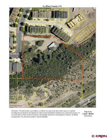 an aerial view of a city with lots of residential buildings and ocean view