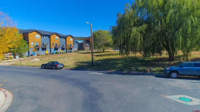 a city view with lots of trees and houses
