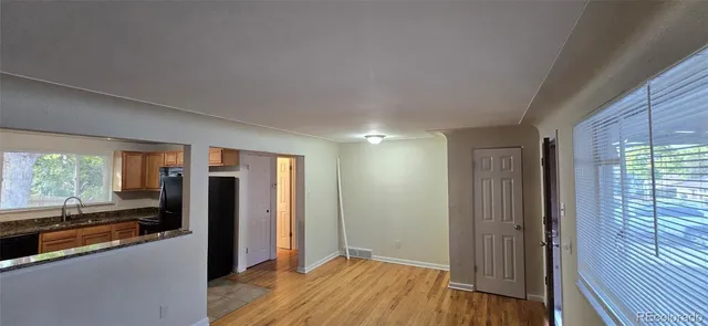 a view of a kitchen from a hallway