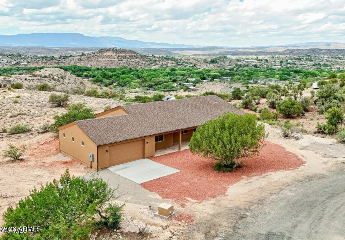 an aerial view of a house with a garden