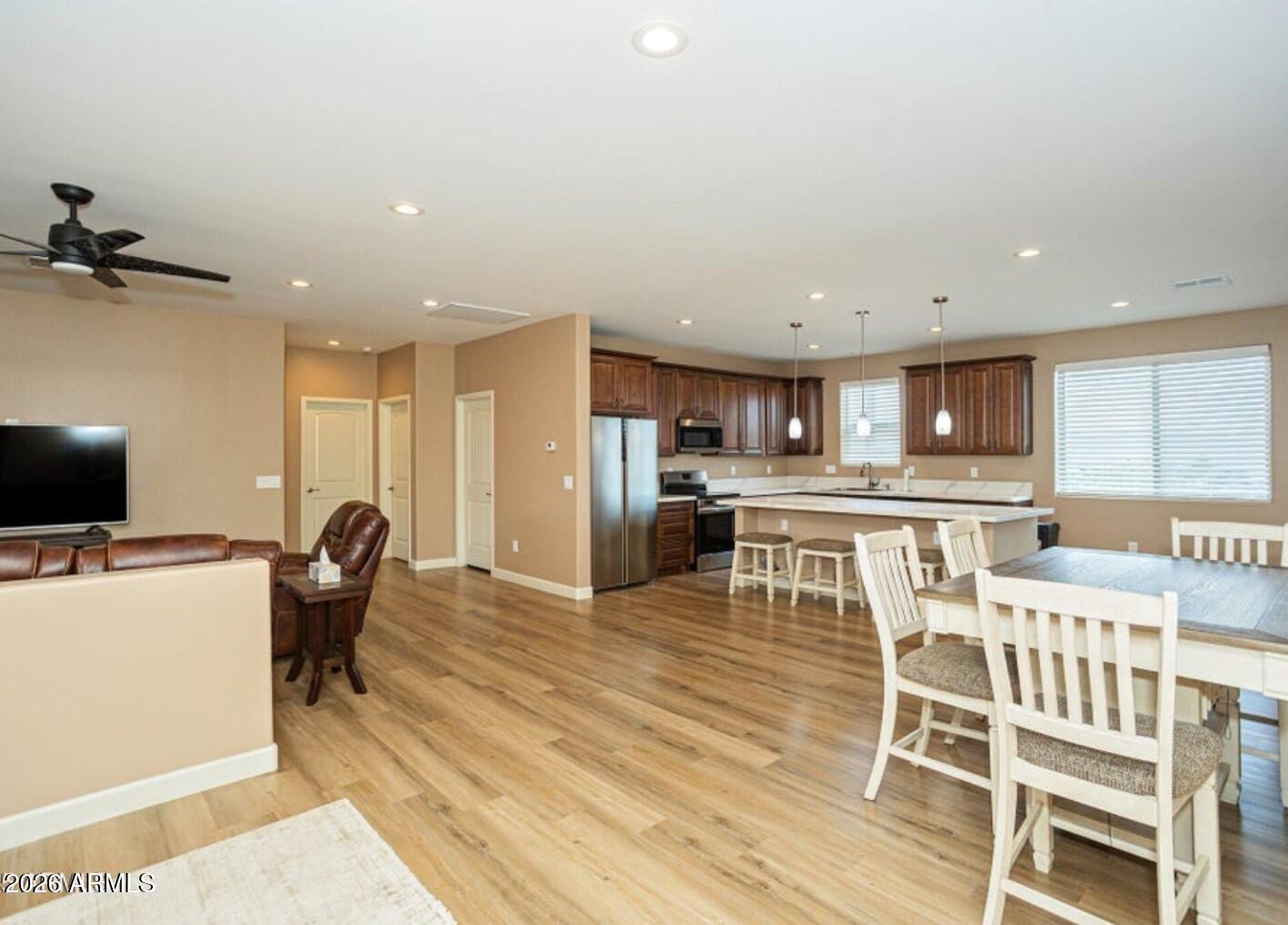 4695 Kerry Drive Rimrock, AZ 86335 - Photo 13 of 47 a view of a dining room with furniture and a wooden floor