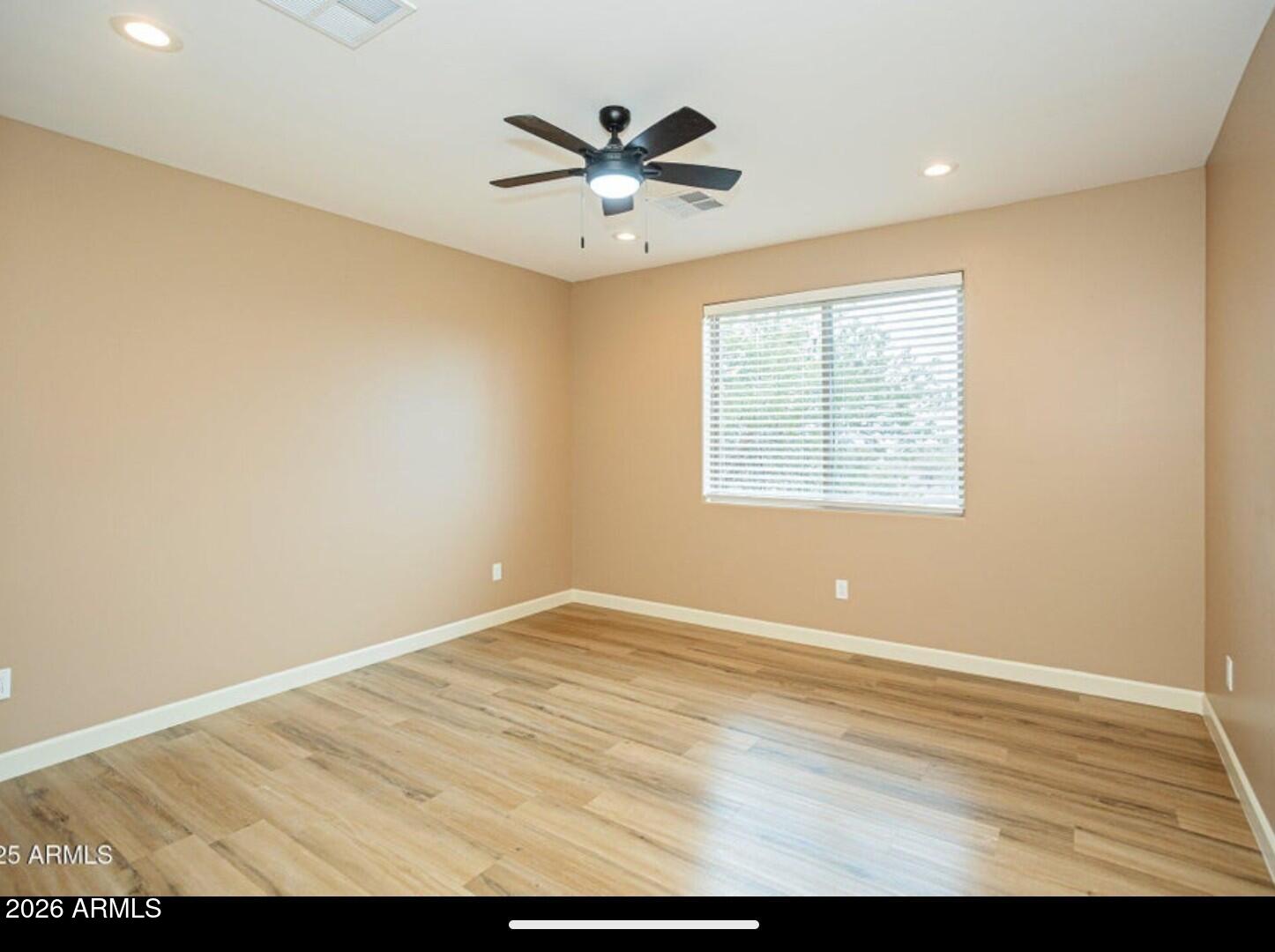 4695 Kerry Drive Rimrock, AZ 86335 - Photo 30 of 47 an empty room with window and ceiling fan