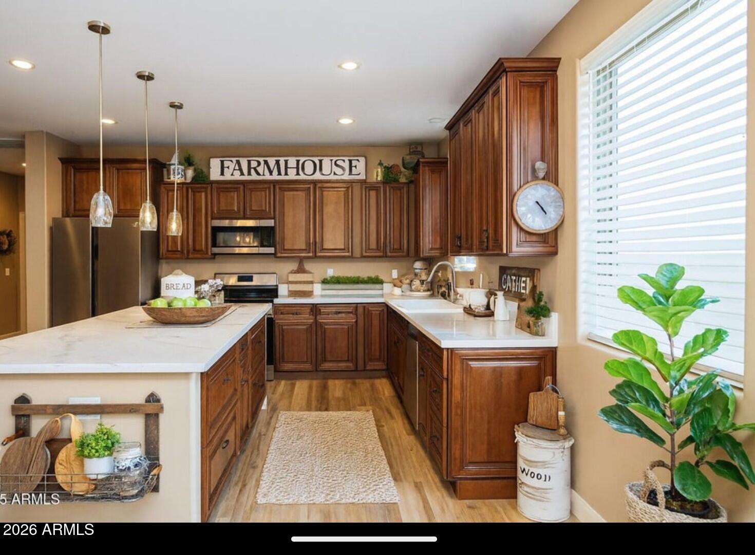 4695 Kerry Drive Rimrock, AZ 86335 - Photo 3 of 47 a kitchen with kitchen island granite countertop a stove a sink a refrigerator and a microwave