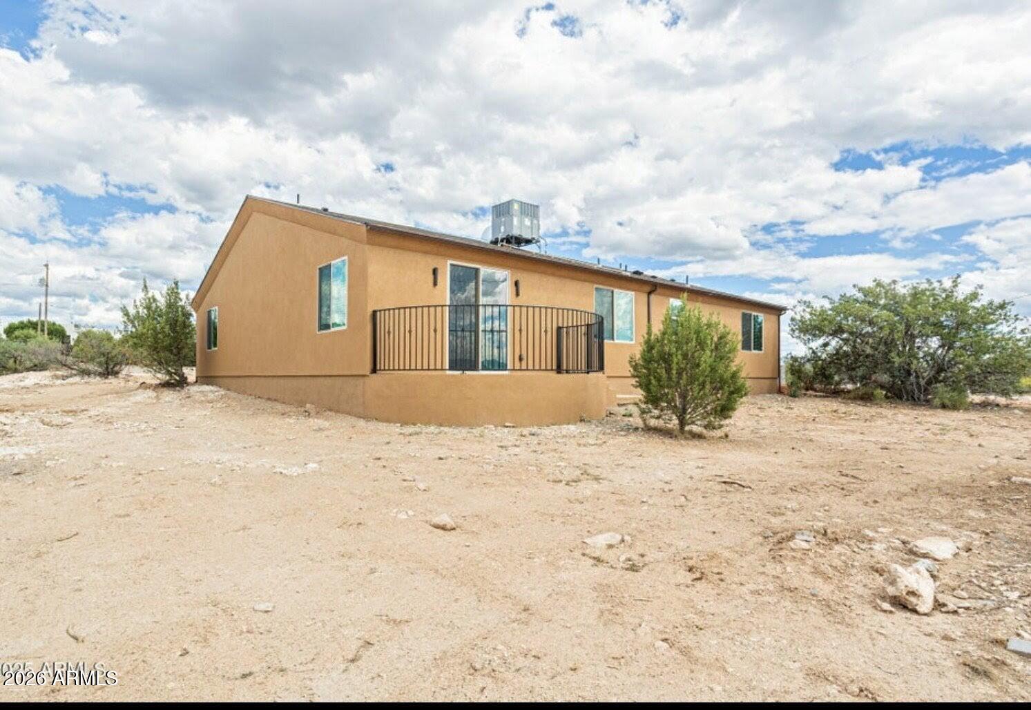 4695 Kerry Drive Rimrock, AZ 86335 - Photo 43 of 47 a view of a dry yard with a house