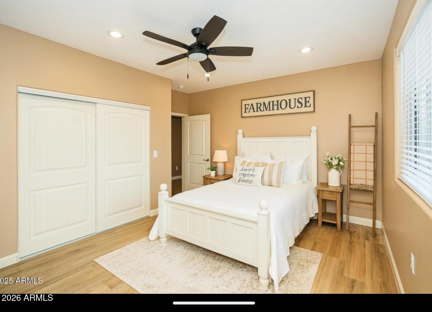 4695 Kerry Drive Rimrock, AZ 86335 - Photo 7 of 47 a bedroom with a large bed and a chandelier