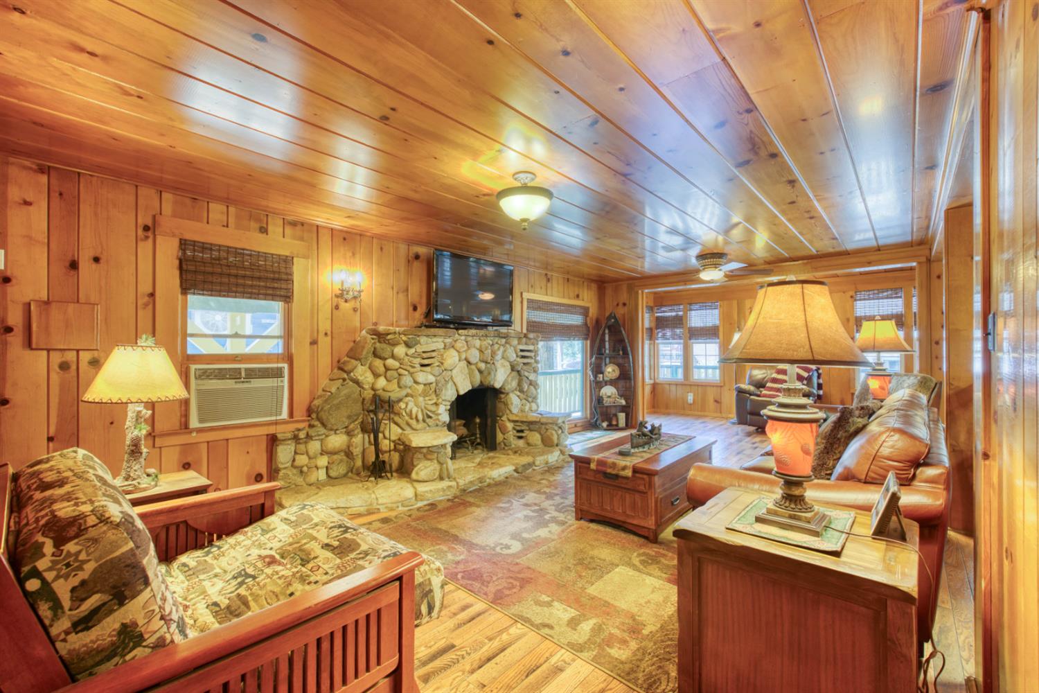 42025 Tollhouse Road Shaver Lake, CA 93664 - Photo 38 of 64 a living room with furniture and a fireplace