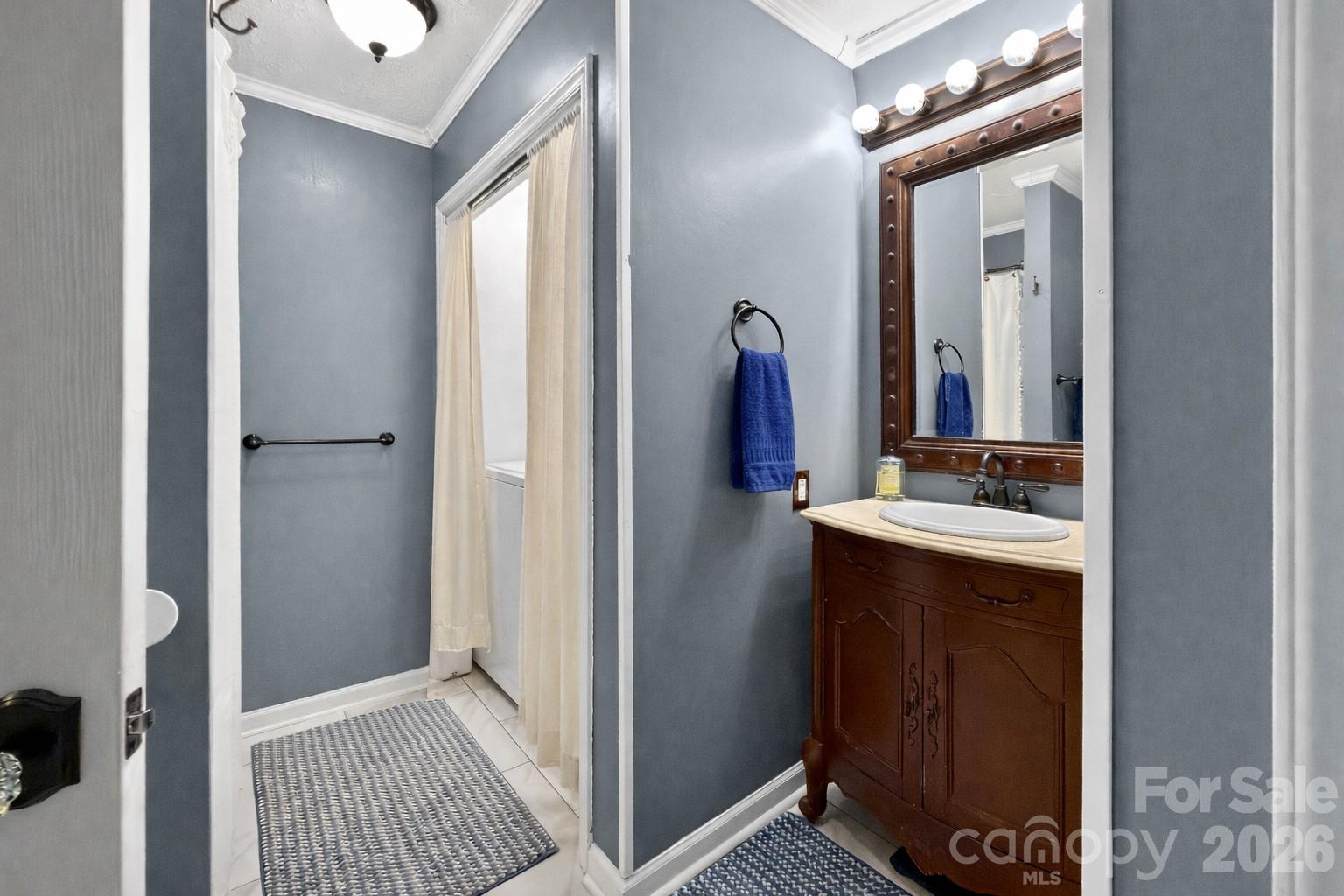 1137 Gilboa Church Road Rutherfordton, NC 28139 - Photo 13 of 21 a bathroom with a sink a mirror and a shower