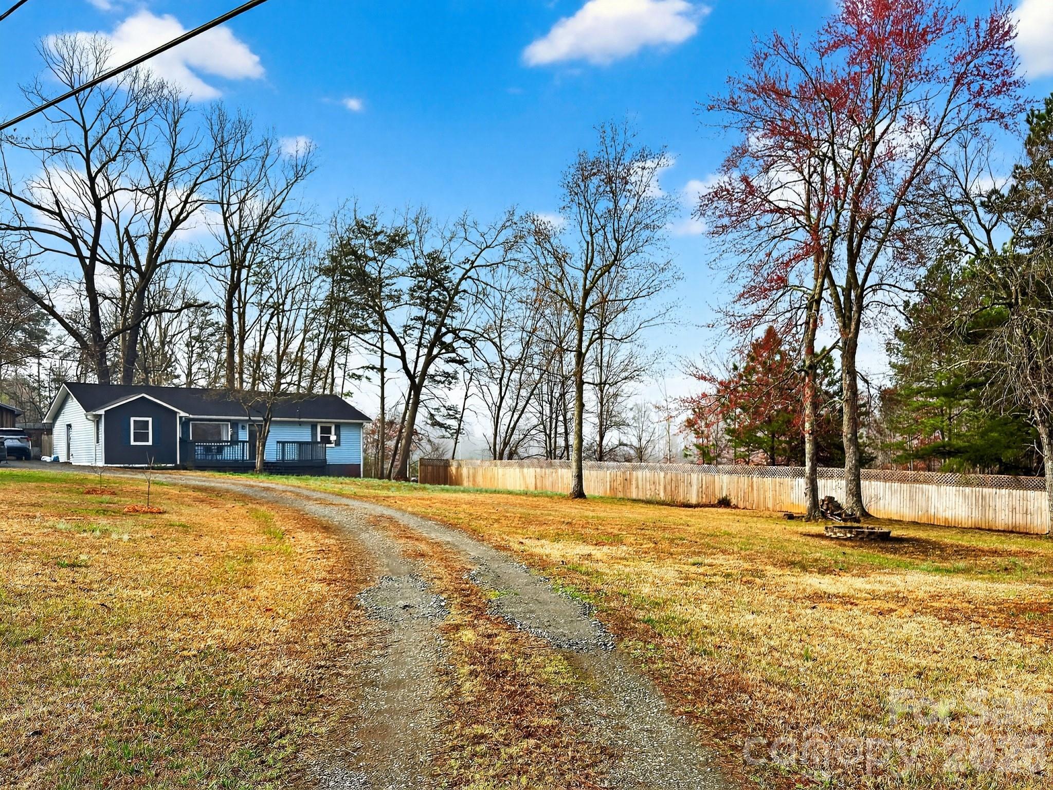 1137 Gilboa Church Road Rutherfordton, NC 28139 - Photo 20 of 21 a view of an house with swimming pool and trees in the background