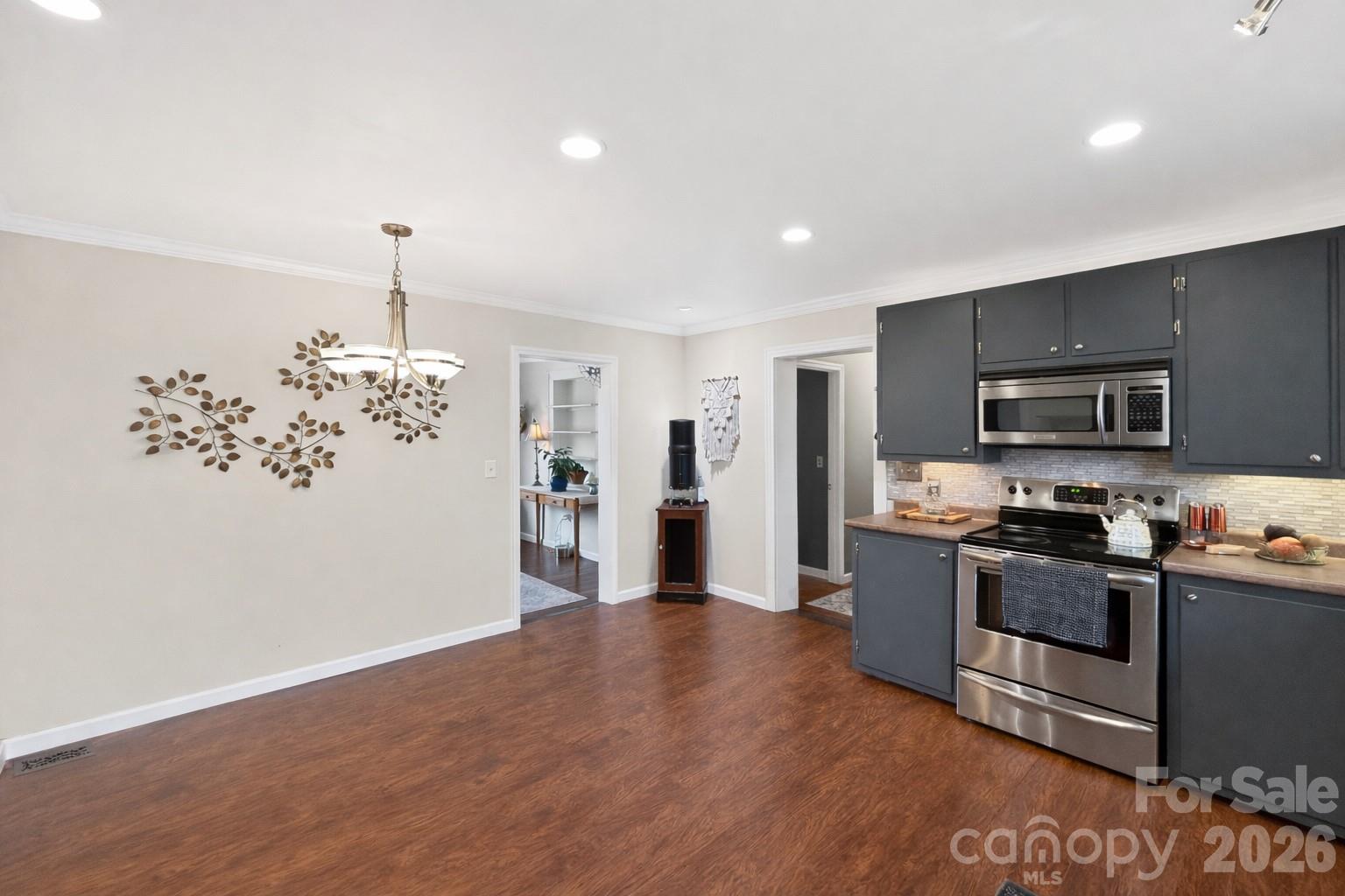 1137 Gilboa Church Road Rutherfordton, NC 28139 - Photo 9 of 21 a kitchen with stainless steel appliances granite countertop a refrigerator a stove top oven a sink and dishwasher