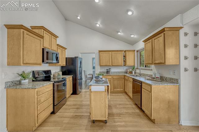 26 Mountain View Road Manitou Springs, CO 80829 - Photo 10 of 48 The entire main level has vaulted ceilings and the kitchen also comes with a mobile stainless top island