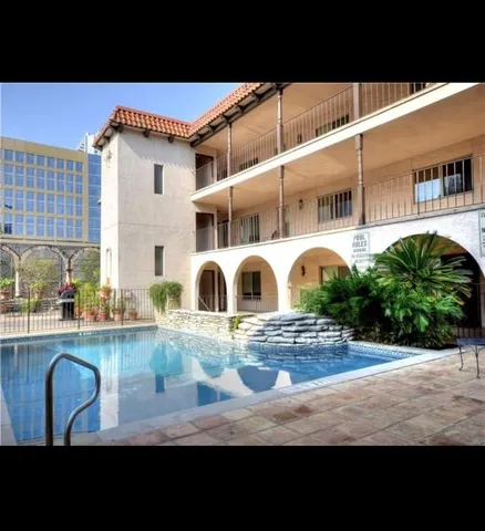 a kitchen with table and chairs