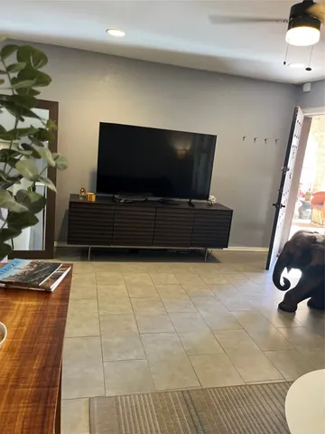 a kitchen with granite countertop a stove and a microwave