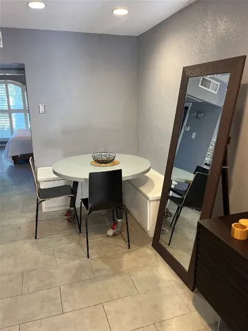 a kitchen with granite countertop a stove and a microwave