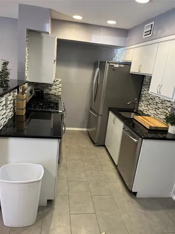 a view of street with parked cars