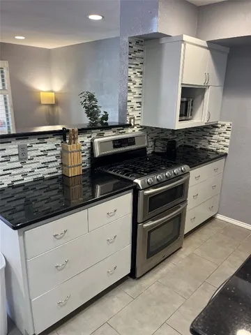 a view of a big house with a street