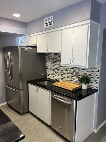 a bathroom with a sink a toilet and a shower