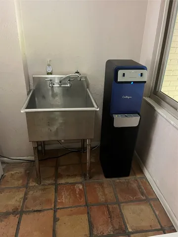 a view of a big house with a street