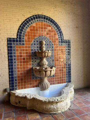 a view of a living room and bathroom with a balcony