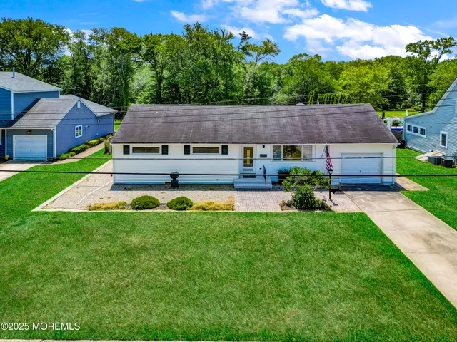 a aerial view of a house with a big yard