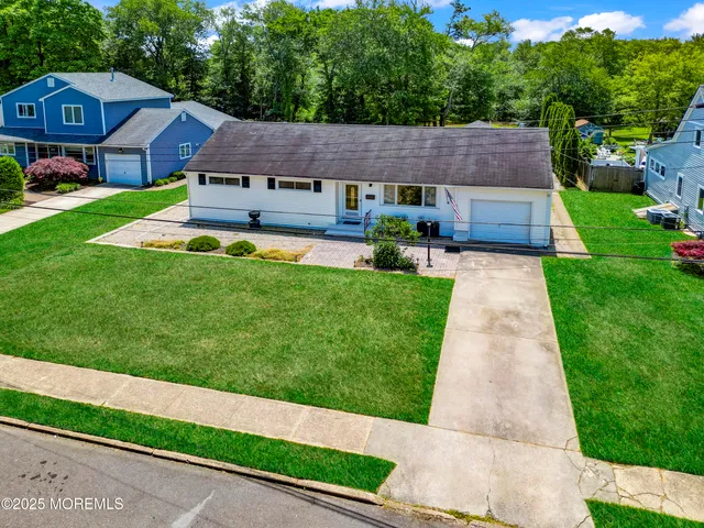 a aerial view of a house with a yard