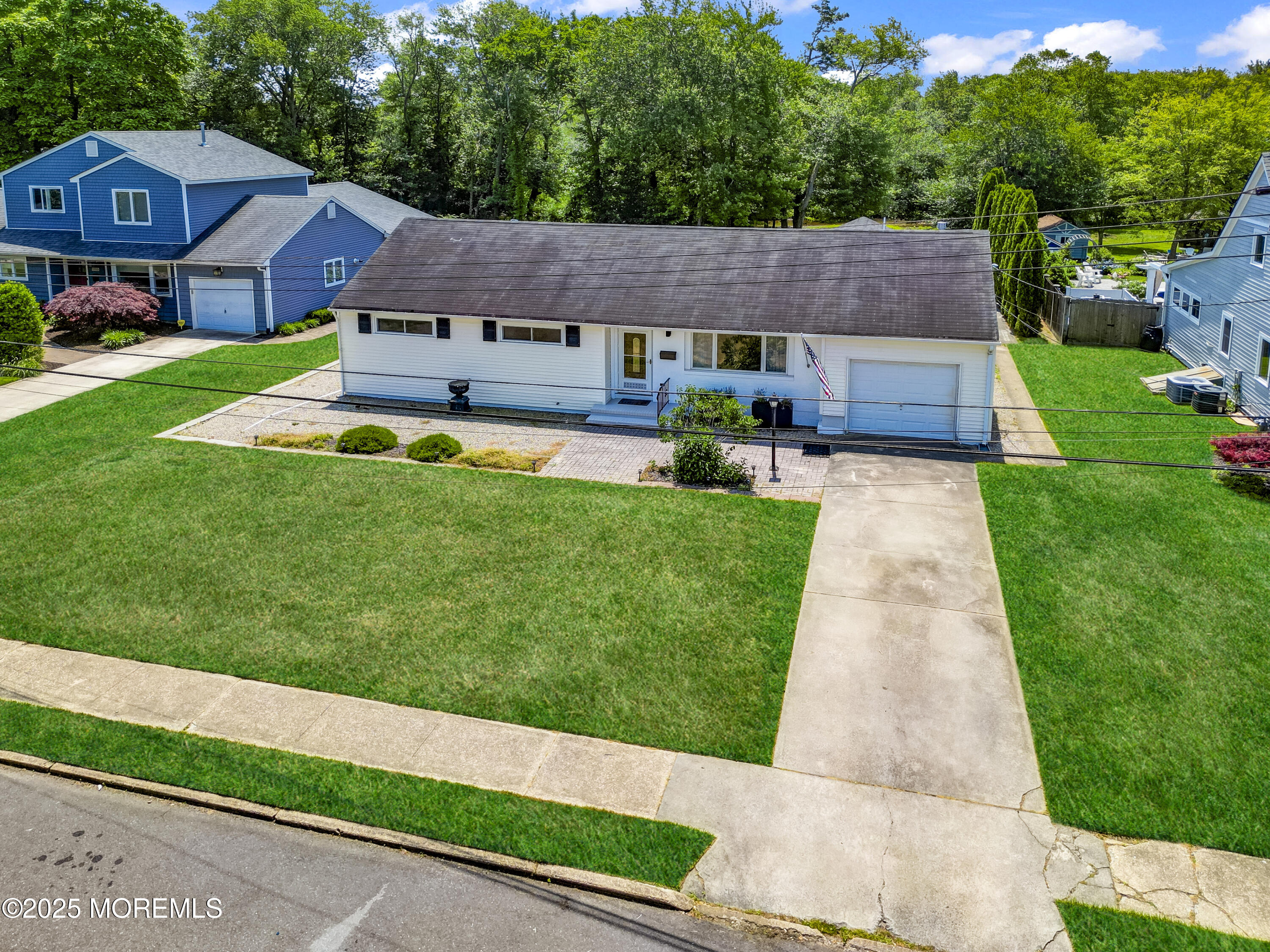 1007 Shore Road Spring Lake Heights, NJ 07762 - Photo 2 of 53 a aerial view of a house with a yard