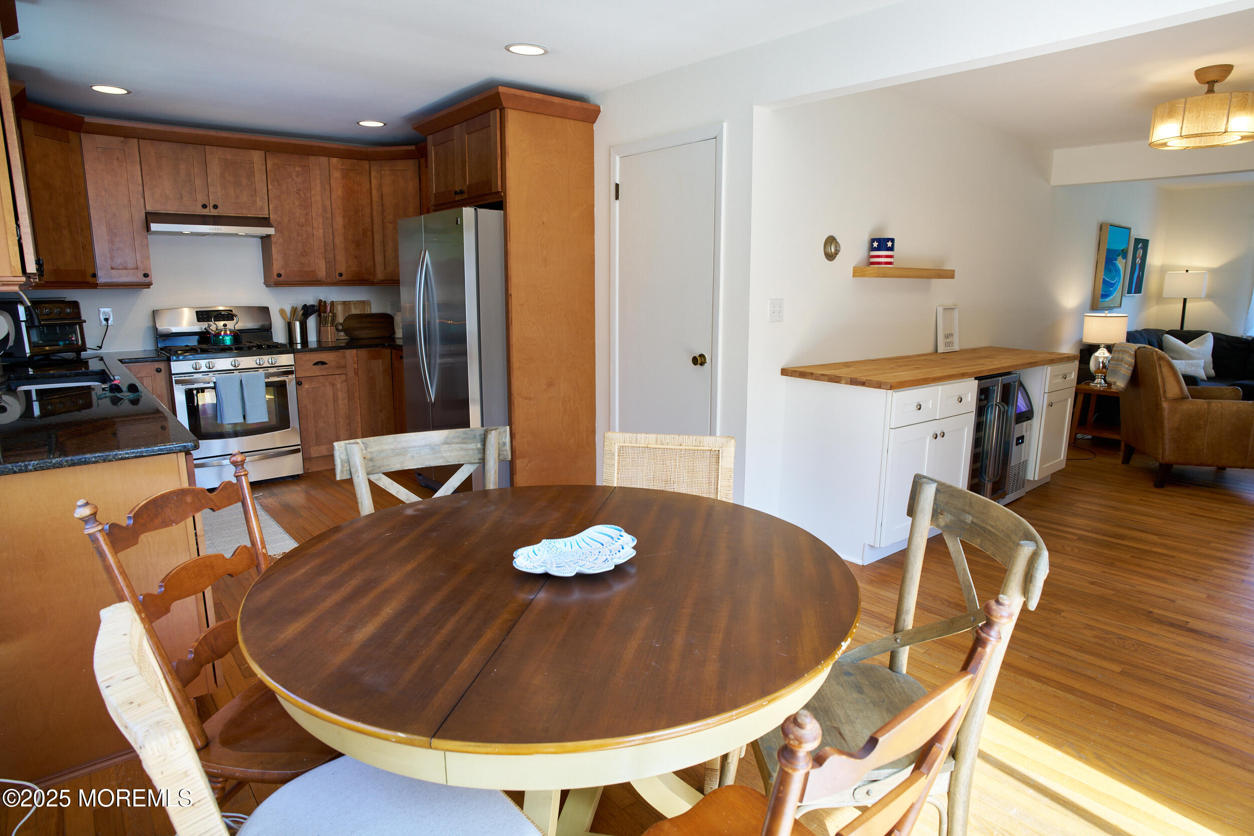 1007 Shore Road Spring Lake Heights, NJ 07762 - Photo 21 of 53 a kitchen with stainless steel appliances granite countertop a dining table and chairs