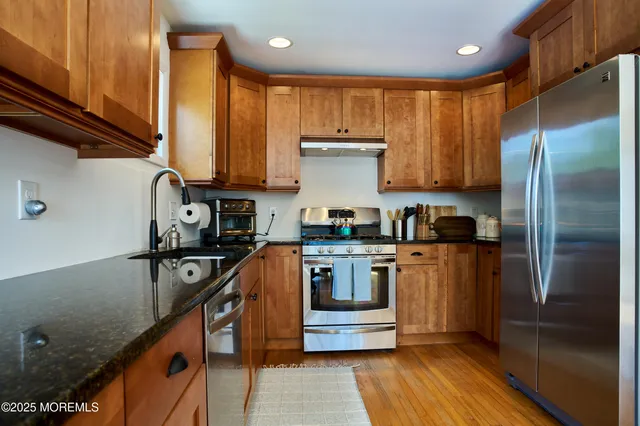 a kitchen with a stove and a microwave