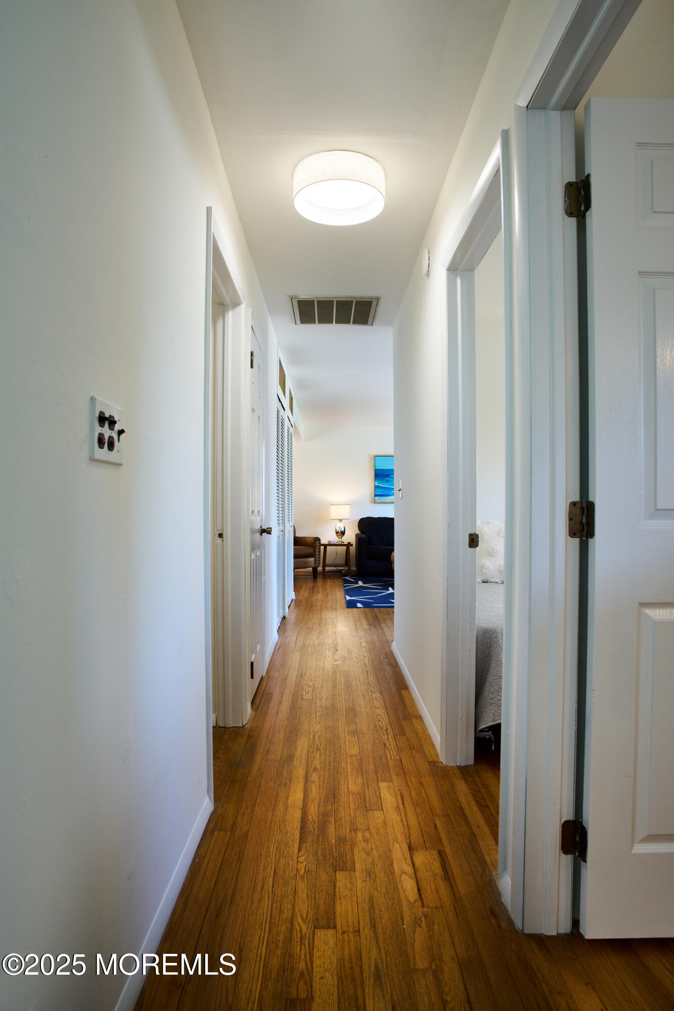 1007 Shore Road Spring Lake Heights, NJ 07762 - Photo 26 of 53 a view of a hallway with wooden floor and staircase