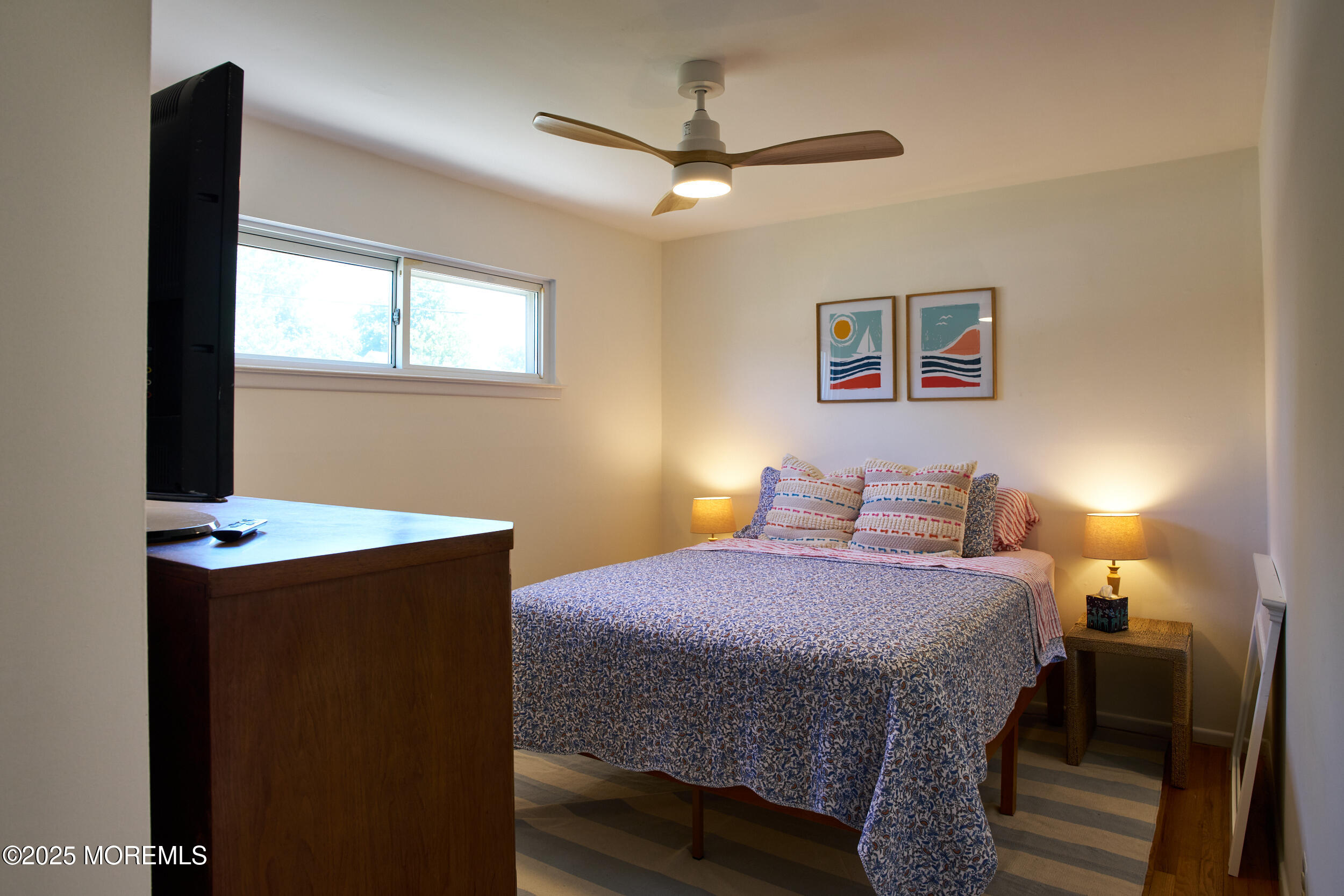 1007 Shore Road Spring Lake Heights, NJ 07762 - Photo 33 of 53 a bedroom with a bed and a table