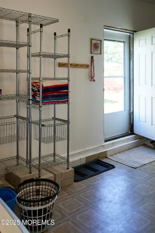 a view of a patio with table and chairs with wooden floor and fence