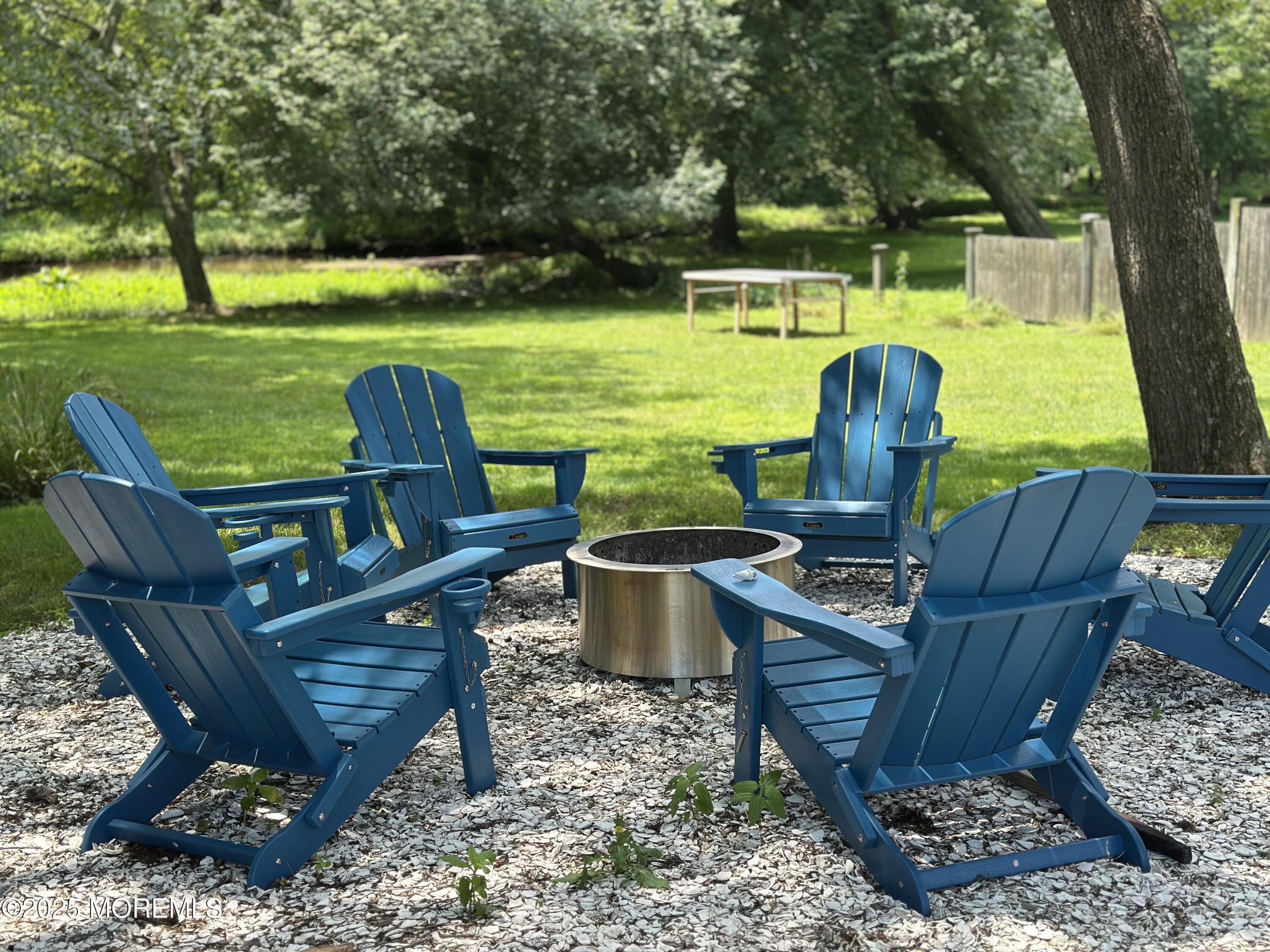 1007 Shore Road Spring Lake Heights, NJ 07762 - Photo 42 of 53 a view of a chairs and table in the garden