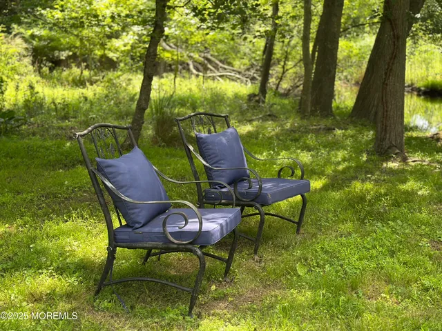 a view of a lake with a forest