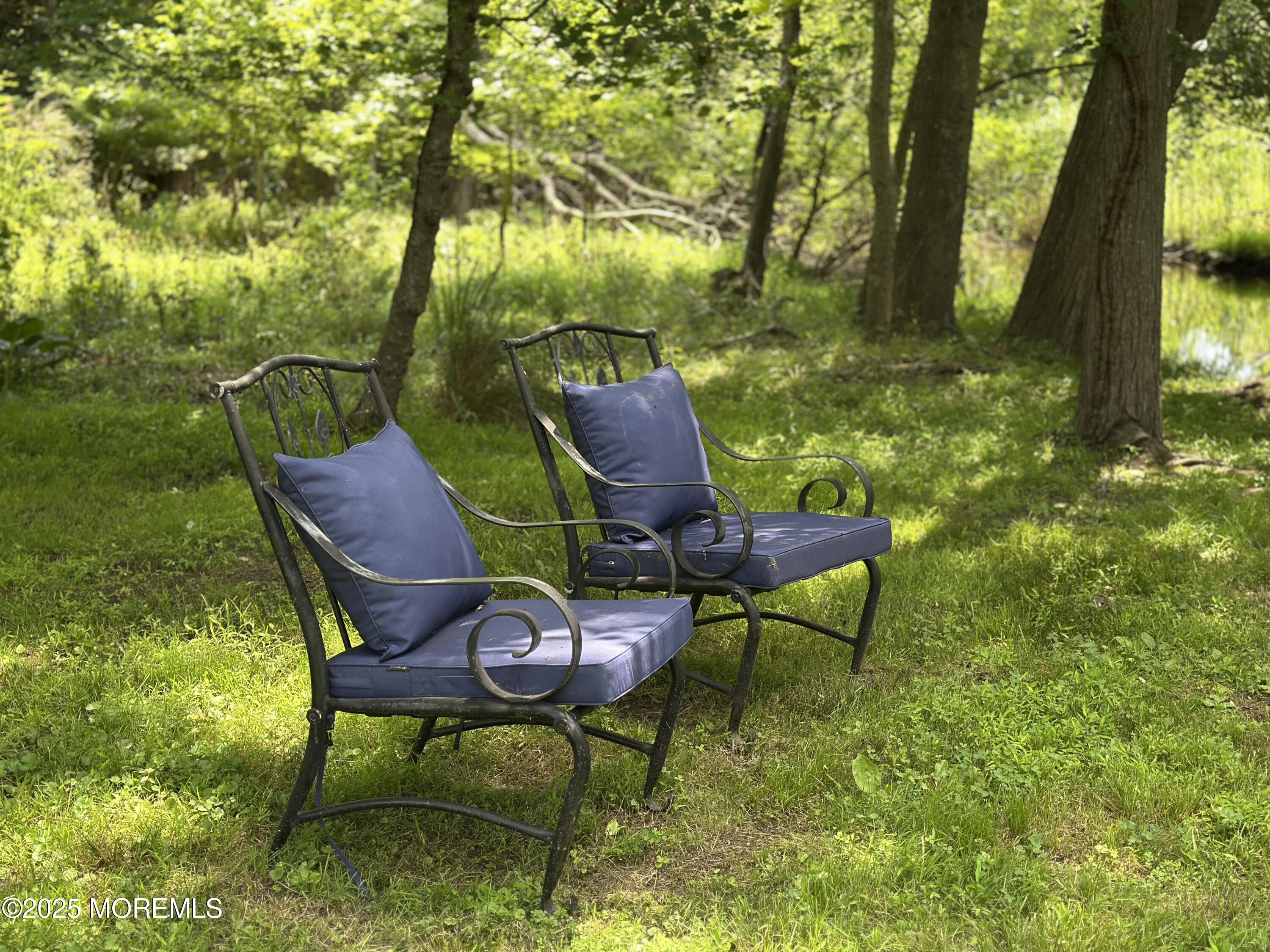 1007 Shore Road Spring Lake Heights, NJ 07762 - Photo 43 of 53 a backyard of a house with table and chairs