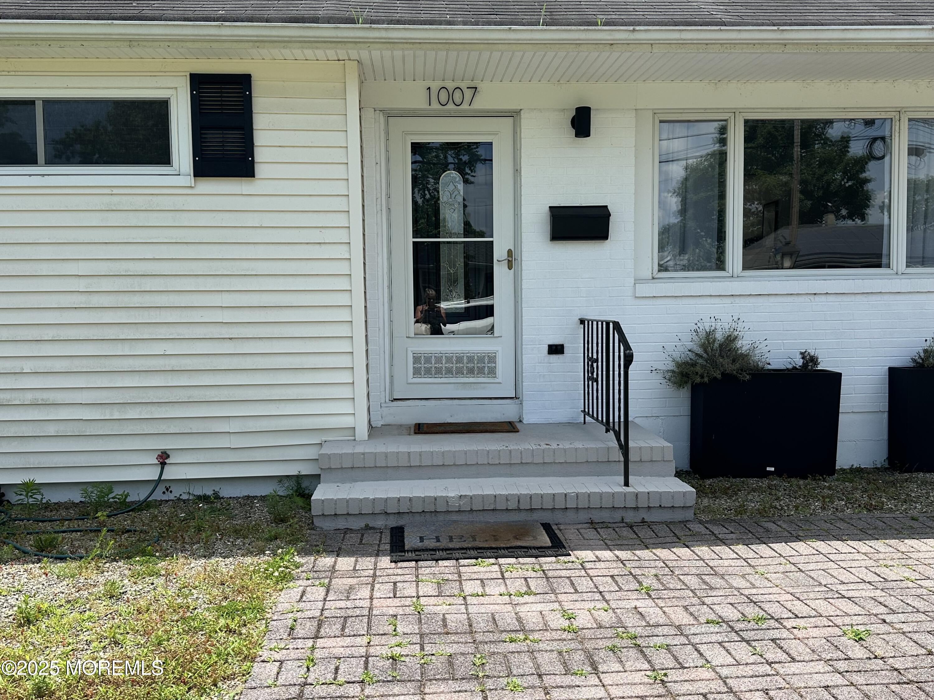 1007 Shore Road Spring Lake Heights, NJ 07762 - Photo 49 of 53 a front view of a house with a yard
