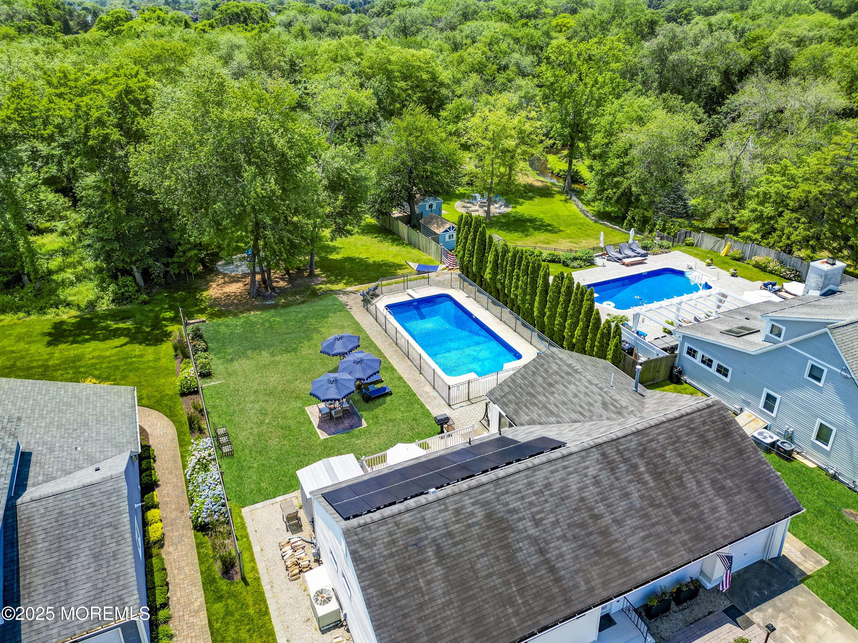 1007 Shore Road Spring Lake Heights, NJ 07762 - Photo 51 of 53 an aerial view of a house with swimming pool a patio and yard