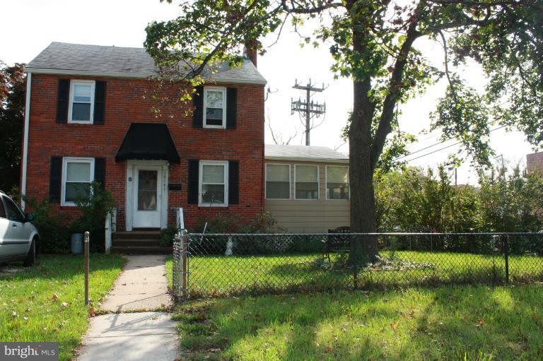 10141 Sutherland Road Silver Spring, MD 20901 - Photo 11 of 11 a front view of a house with a yard