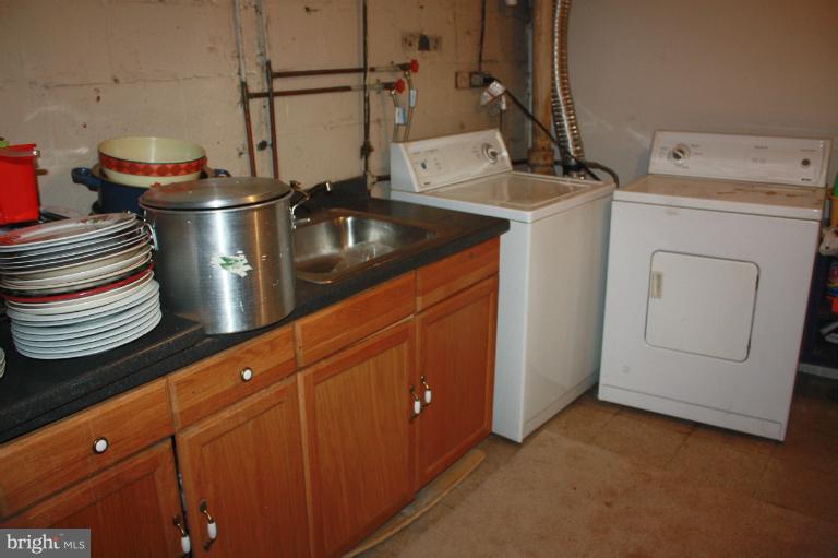 10141 Sutherland Road Silver Spring, MD 20901 - Photo 3 of 11 a kitchen with a sink and cabinets