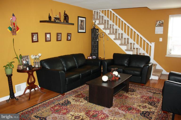 10141 Sutherland Road Silver Spring, MD 20901 - Photo 4 of 11 a living room with furniture and wooden floor