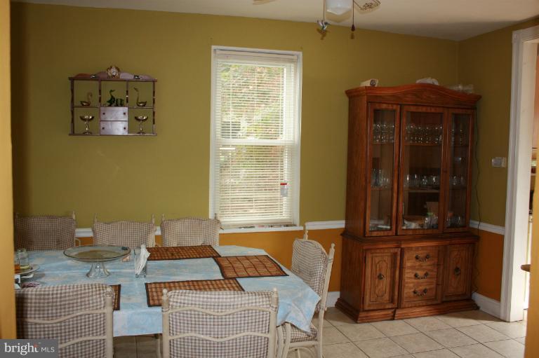 10141 Sutherland Road Silver Spring, MD 20901 - Photo 6 of 11 a dining room with furniture and window