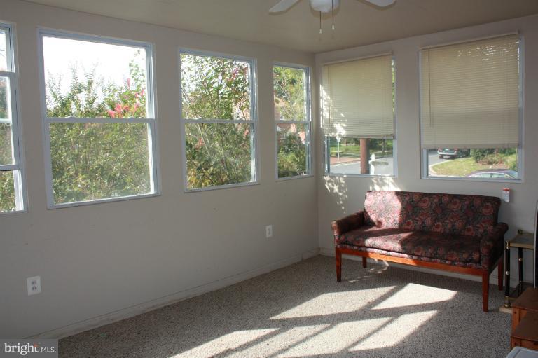 10141 Sutherland Road Silver Spring, MD 20901 - Photo 8 of 11 a living room with furniture and a window