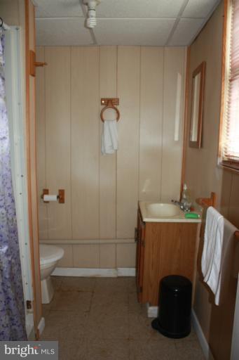 10141 Sutherland Road Silver Spring, MD 20901 - Photo 9 of 11 a bathroom with a sink a toilet and shower