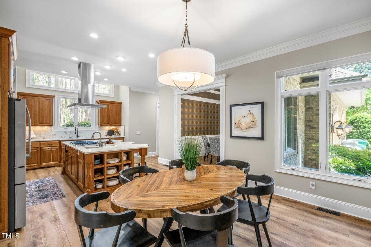 19 Pinewild Drive Pinehurst, NC 28374 - Photo 14 of 44 a view of a dining room with furniture window and wooden floor